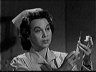 Gloria Blondell as a nurse